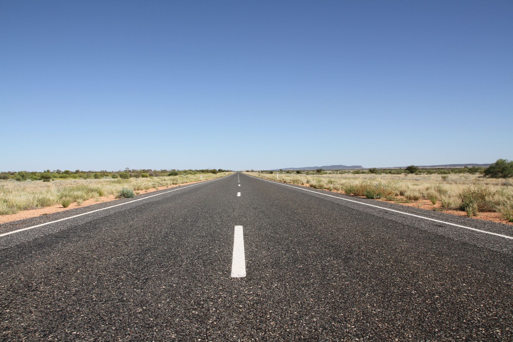 A long straight highway across the Australian outback