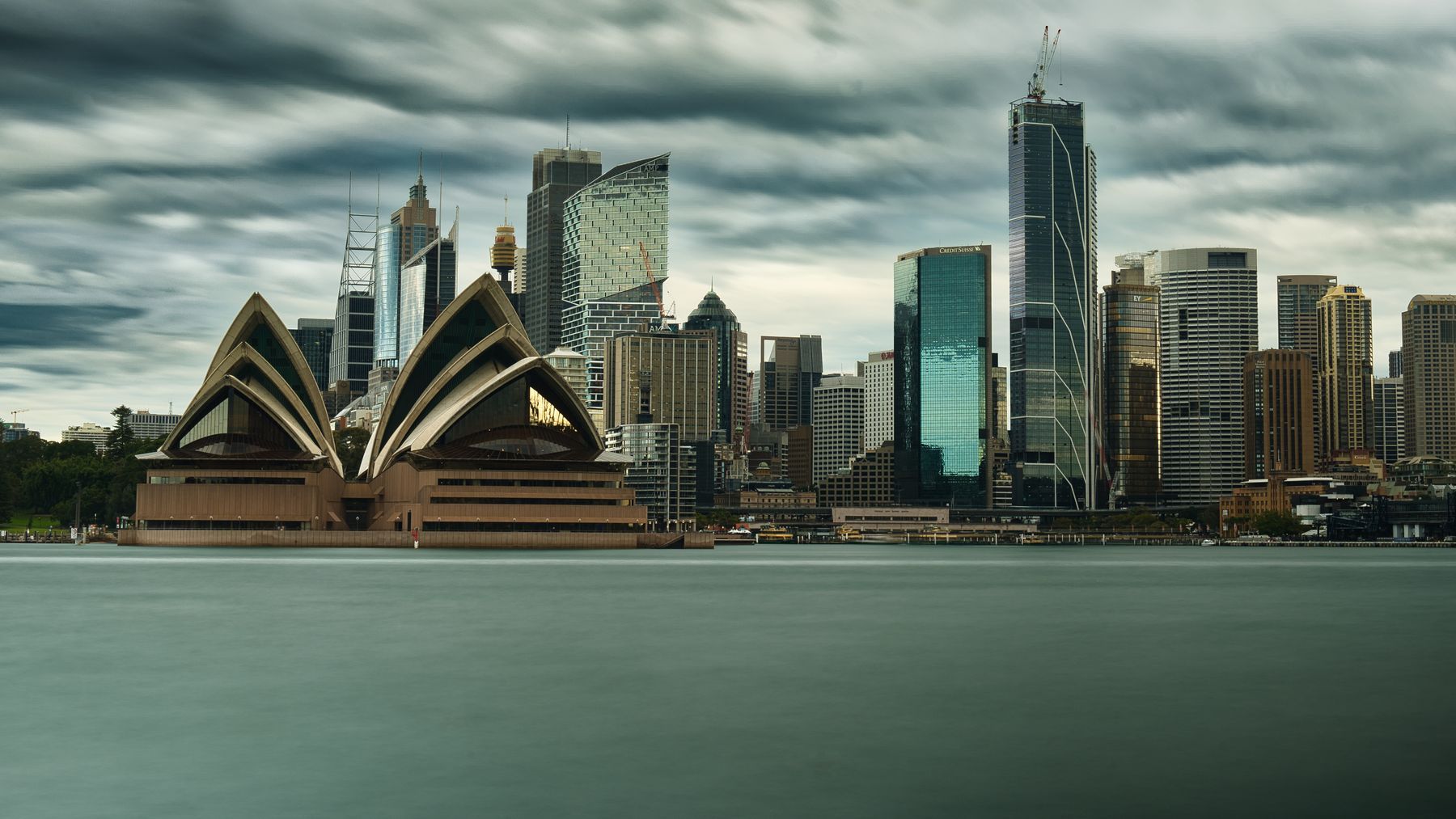 Sydney's skyline and the Opera House under storm clouds