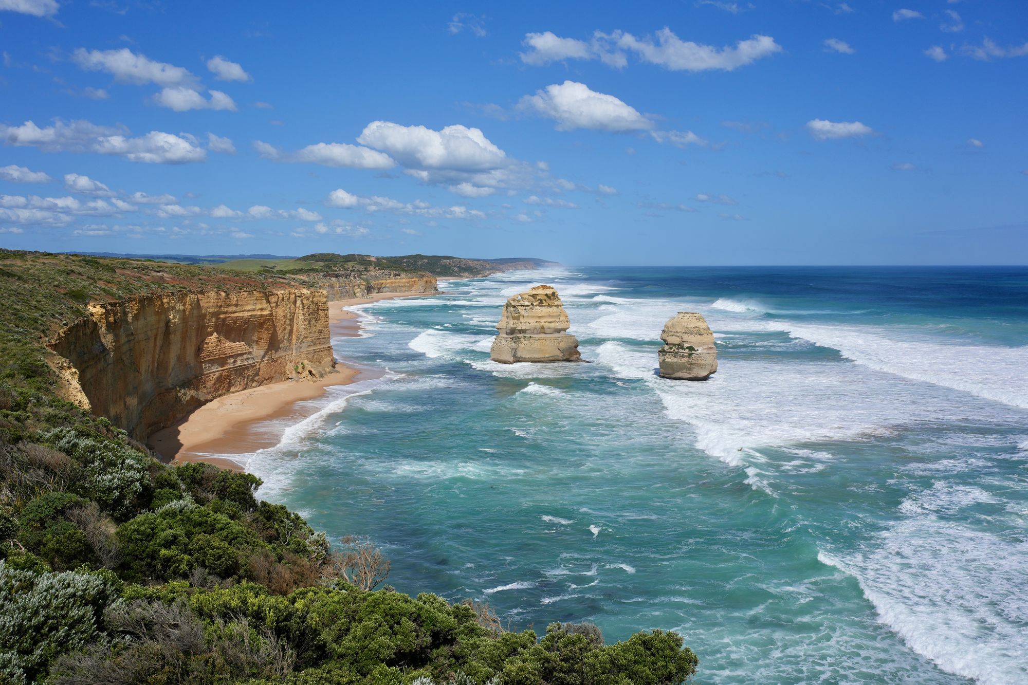 The Twelve Apostles and the cliffs of the Great Ocean Road on a sunny day